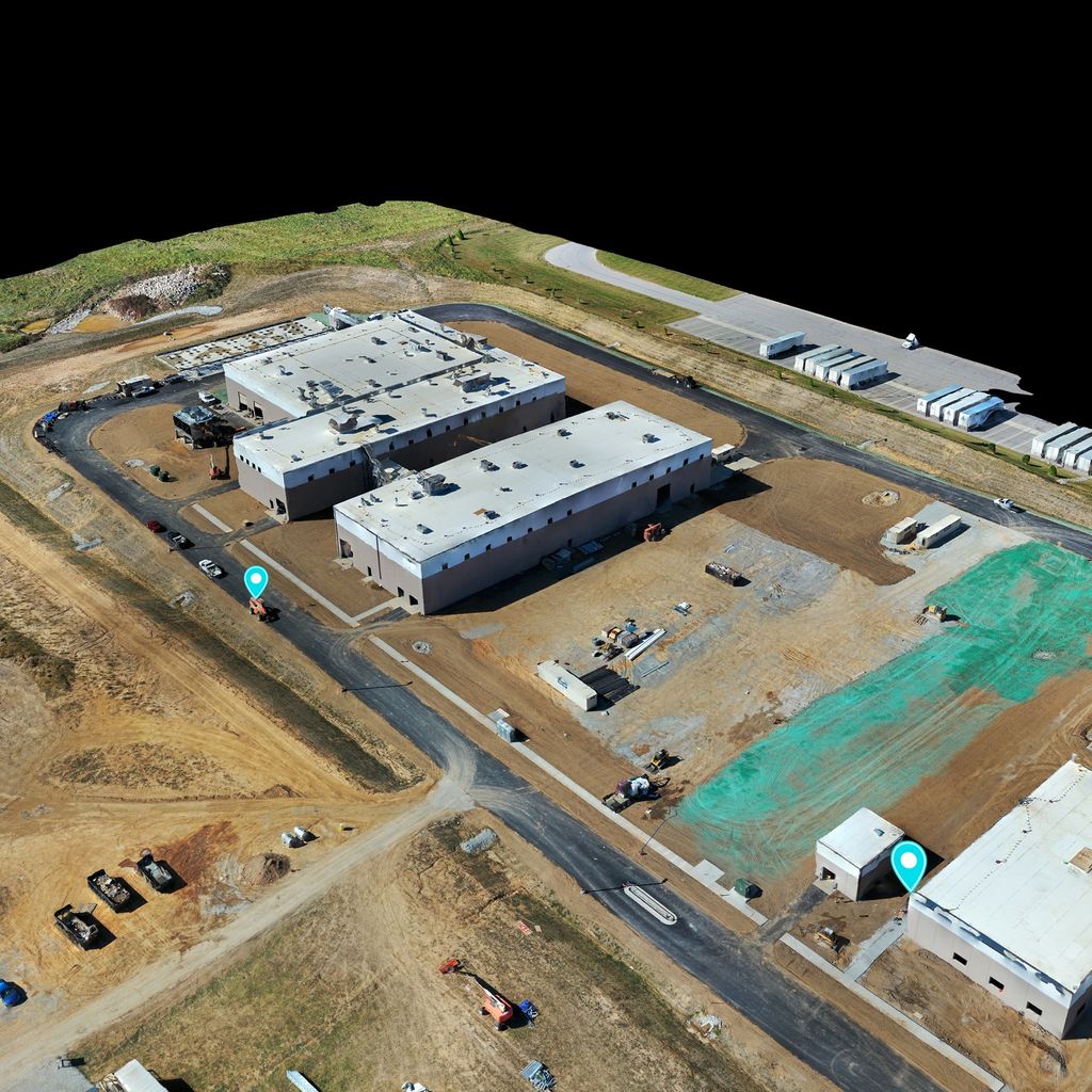Oblique 3D view of an industrial site with erosion control matting and a paved access road