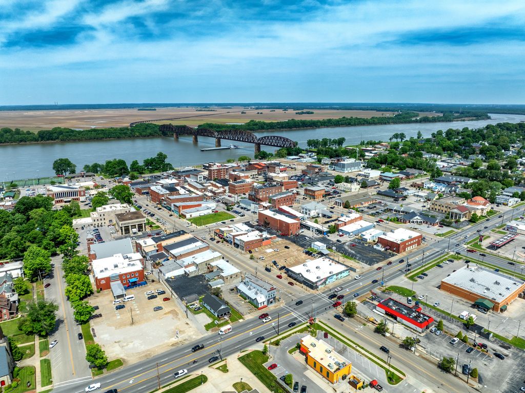 Downtown Henderson rooftops with the Ohio River and railroad bridge beyond