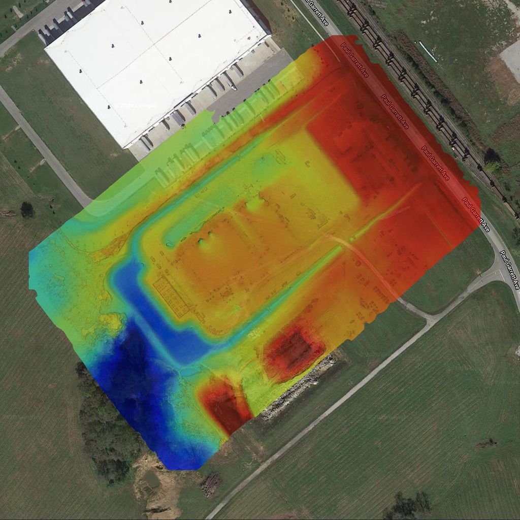 Rainbow elevation map showing low areas across an industrial construction site