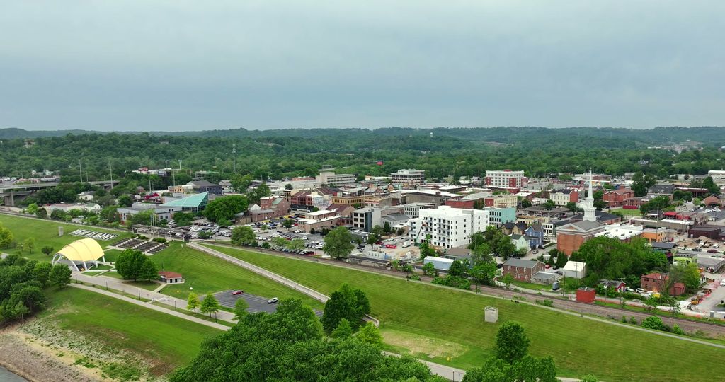 Downtown New Albany and the Ohio River floodwall with a new mixed-use building rising