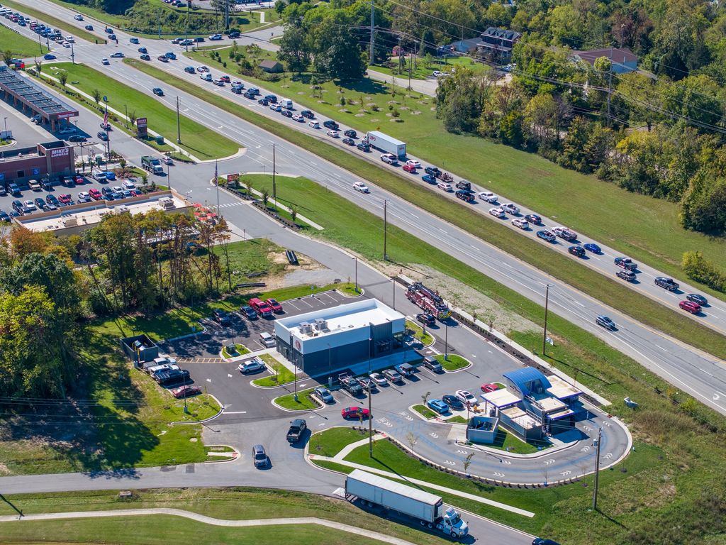 New restaurant and drive-thru pad beside a busy highway